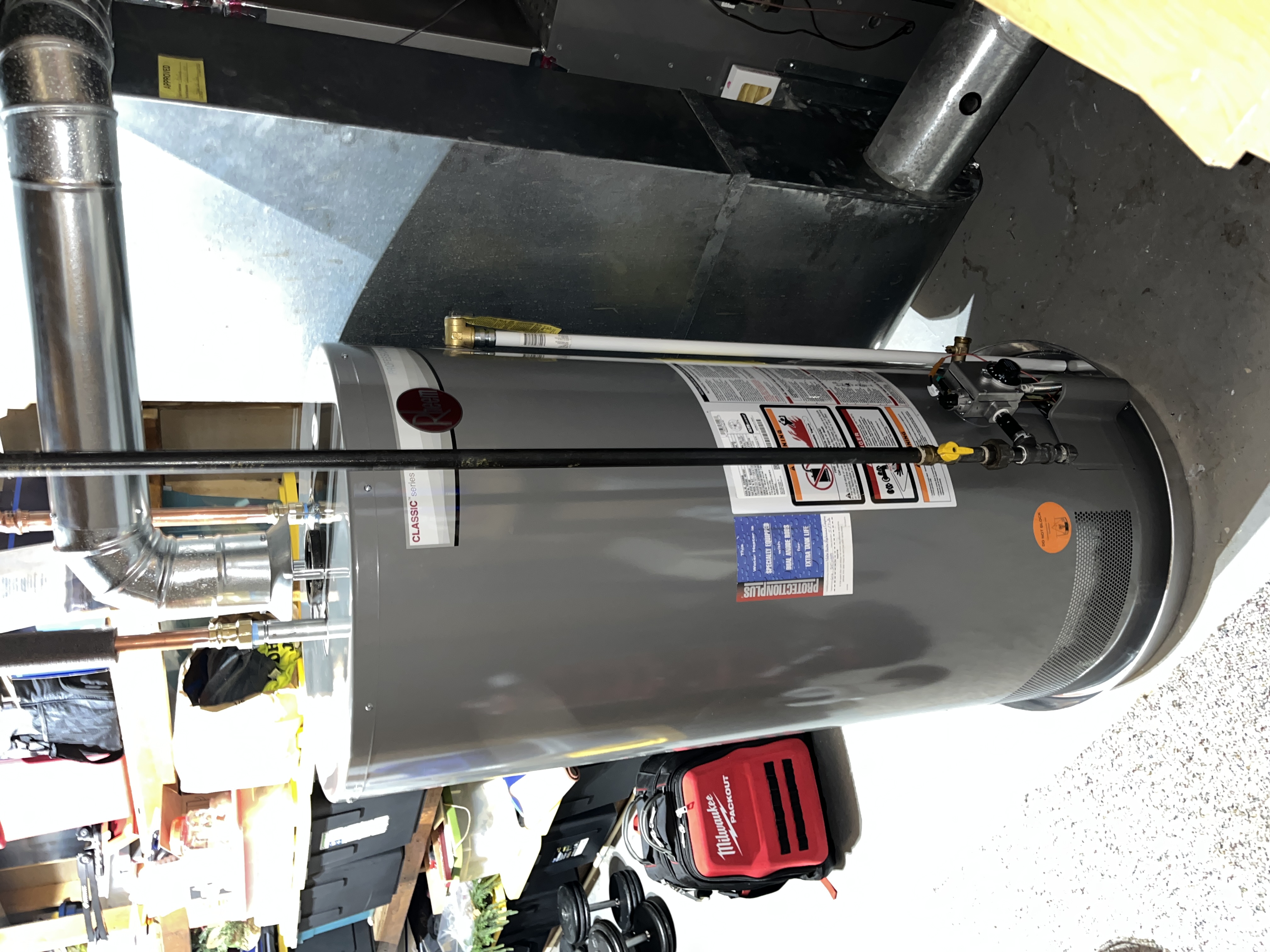 A newly installed Rheem 40 gallon atmospheric natural draft water heater in a Hudsonville basement, matching the review from Rob Bond.