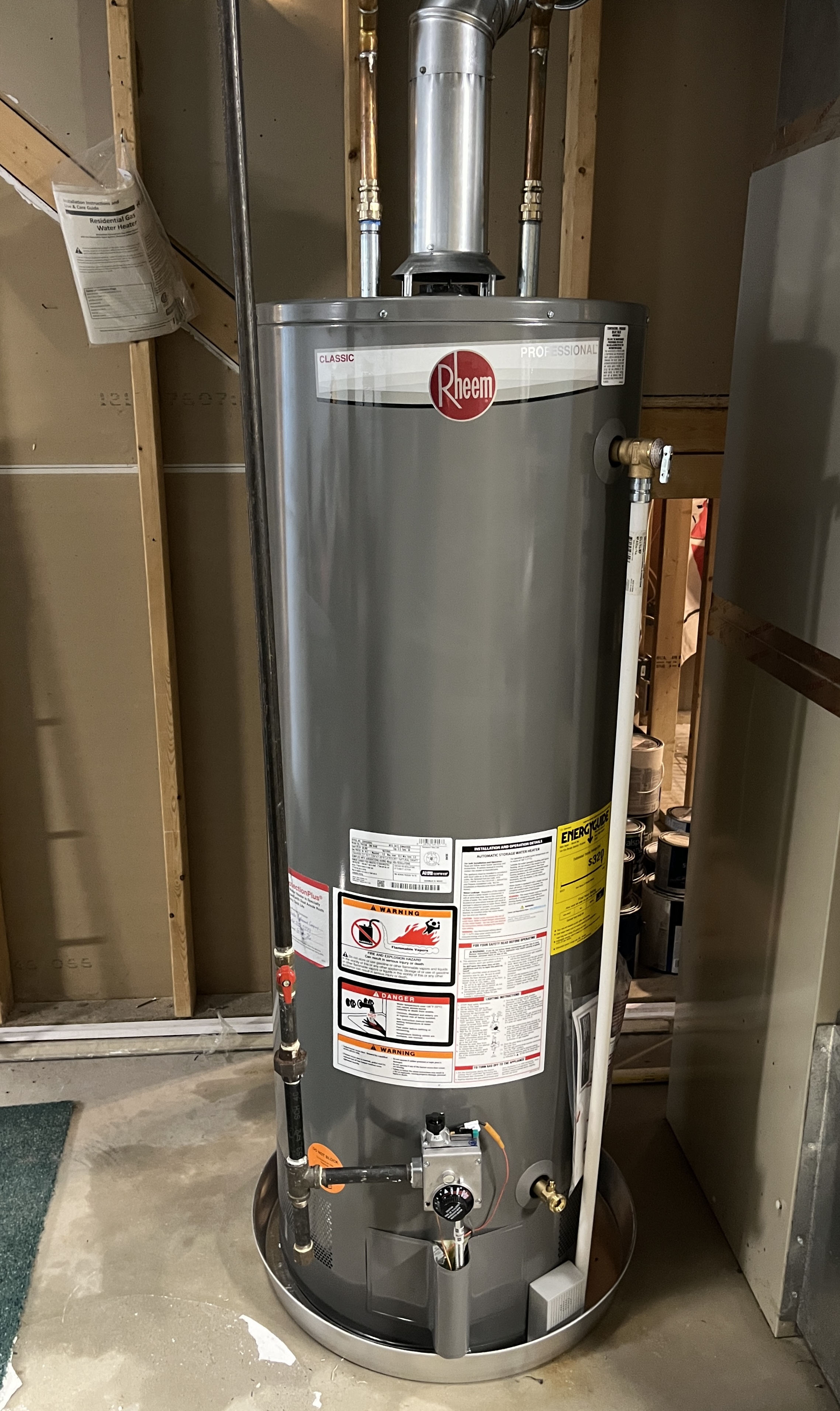 A newly installed Rheem tankless water heater in a Jenison basement, matching the review from Tyler Hippey.