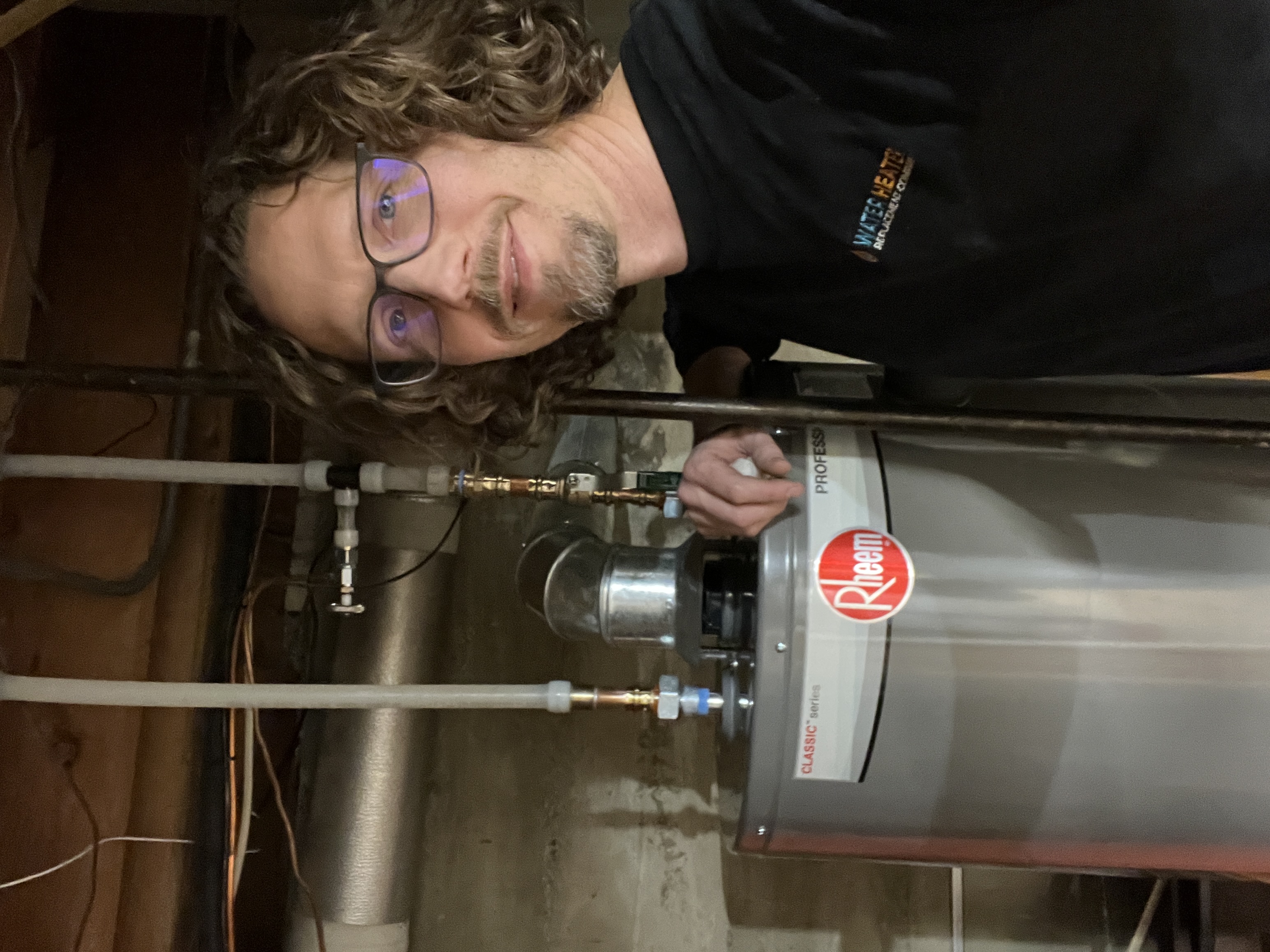 Water Heater Replacement Company technician completing a repair